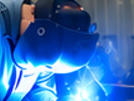Welder fabricating at Safe-T-Shelter